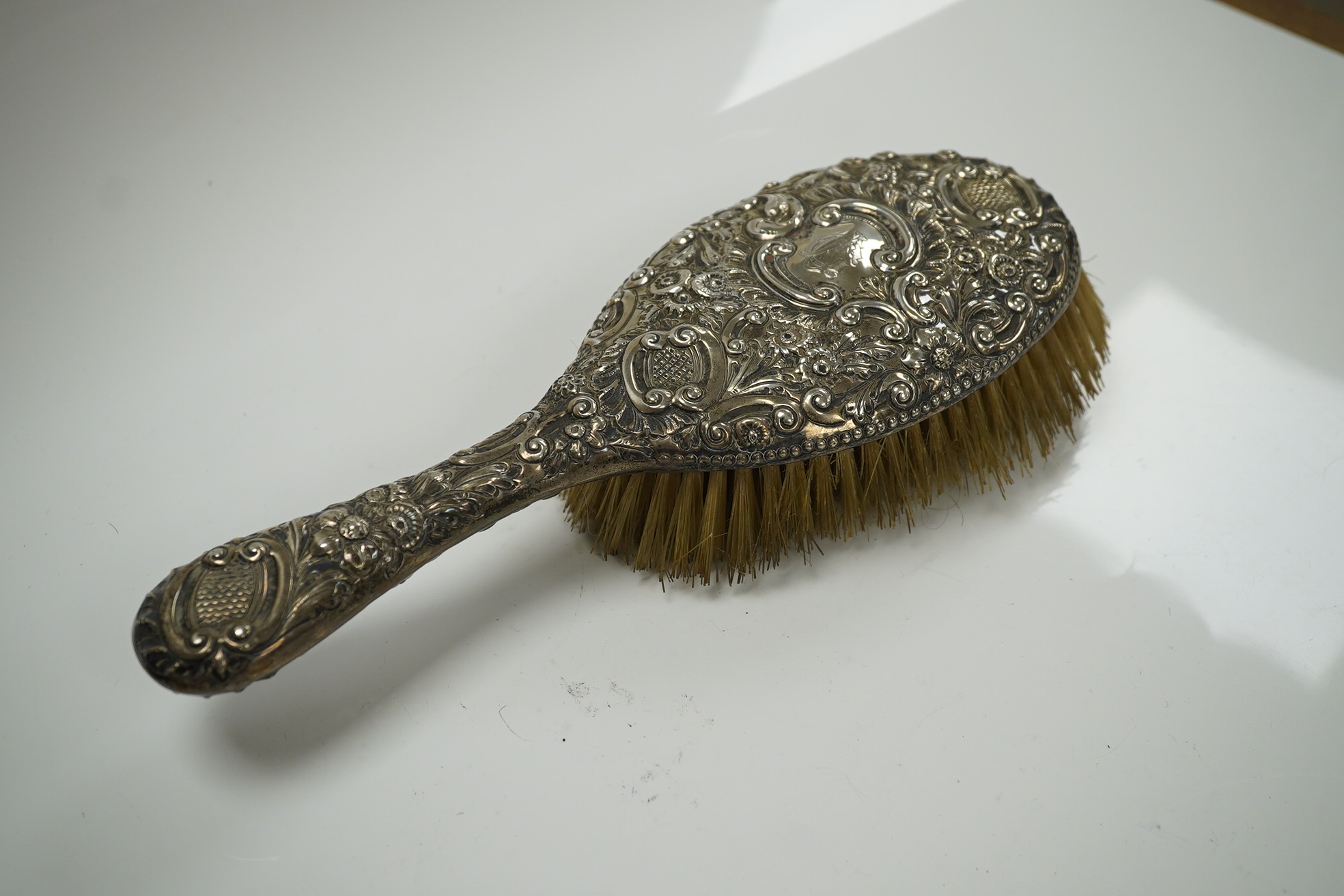 A mixed group of silver including mounted hand mirror, brushes, sugar bowl, napkin rings, bonbon dish, fish slice, part cased set of teaspoons, etc. Condition - poor to fair